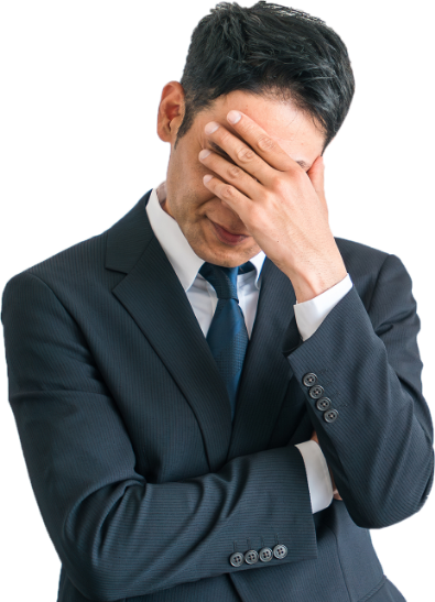 額に手を置き悩みうつむく様子